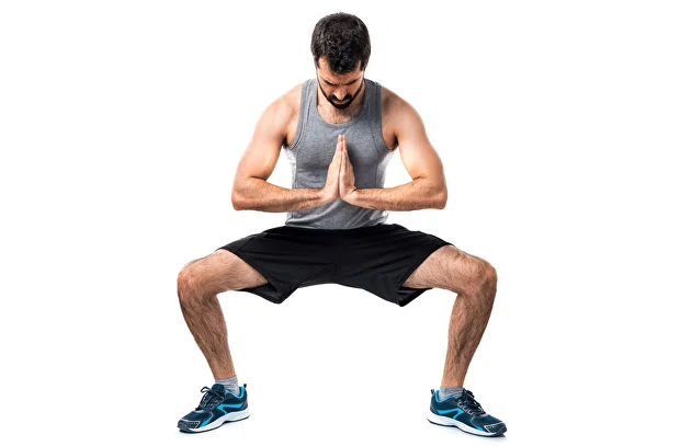 Man doing a sumo squat