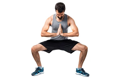 Man doing a sumo squat